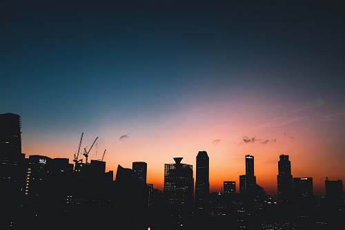 constriction crane silhouette of high rise buildings during golden hour photography sunset